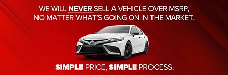 A white Toyota Camry on a red backgound - We Will Never Sell a Vehicle over MSRP, No Matter What's Going on in the Market